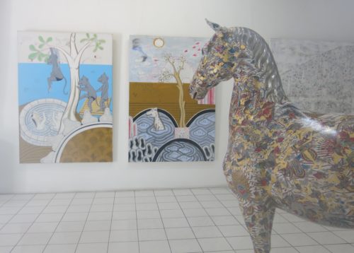 two paintings and horse sculpture