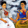 Two Frida Kahlo's painted sitting next to one another with hearts exposed and connected via veins