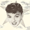 Judy Garland in black and white advertisement, shown with a closeup cut of her face over a star in the sky