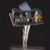 Laurie Simmons' sculpture depicting a model house with women's legs coming out of it beneath